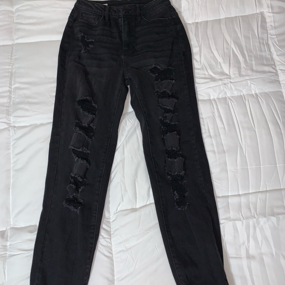 black ripped jeans with cuffed ankles